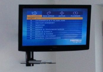 Tv Wall Mounted with a Single Shelf